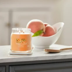 Yankee Candle Farm Fresh Peach Signature Medium Jar Candle -Home General Store yankee candle 1631781e farm fresh peach signature medium jar candle lifestyle 1